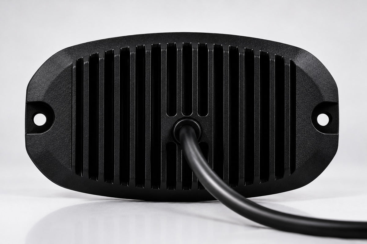 Black LED rock light with cooling fin backplate and attached power cable