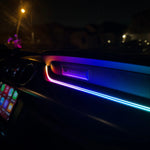 Car door panel ambient LED strip glowing blue-purple near handle