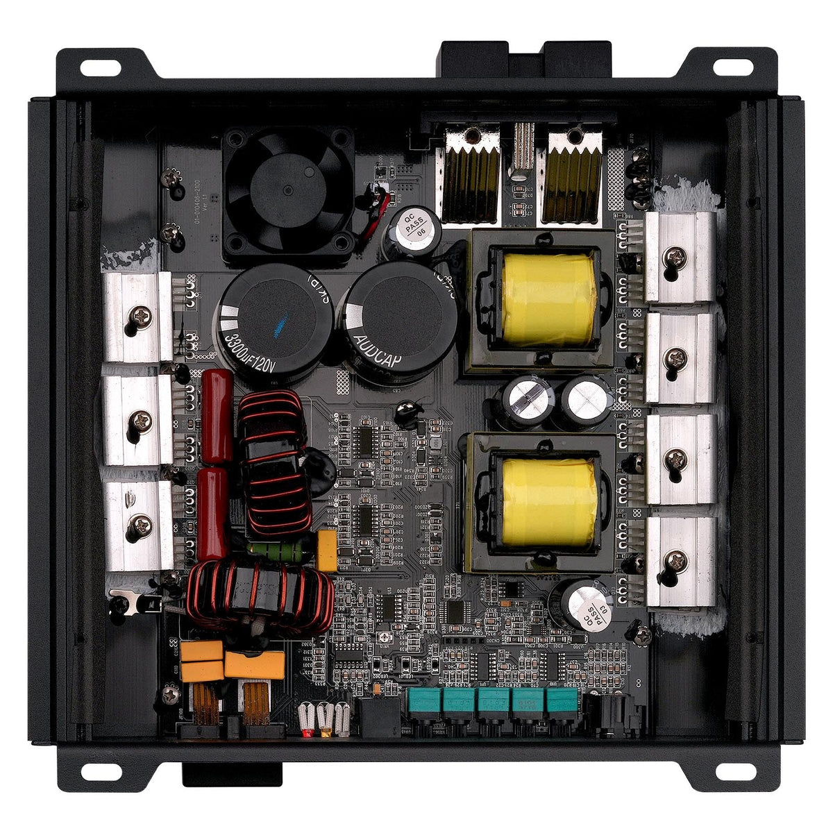 Open black amplifier interior with circuit boards, capacitors, and wiring terminals