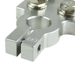 Positive battery terminal detail, brushed metal clamp with plus symbol and screw hole