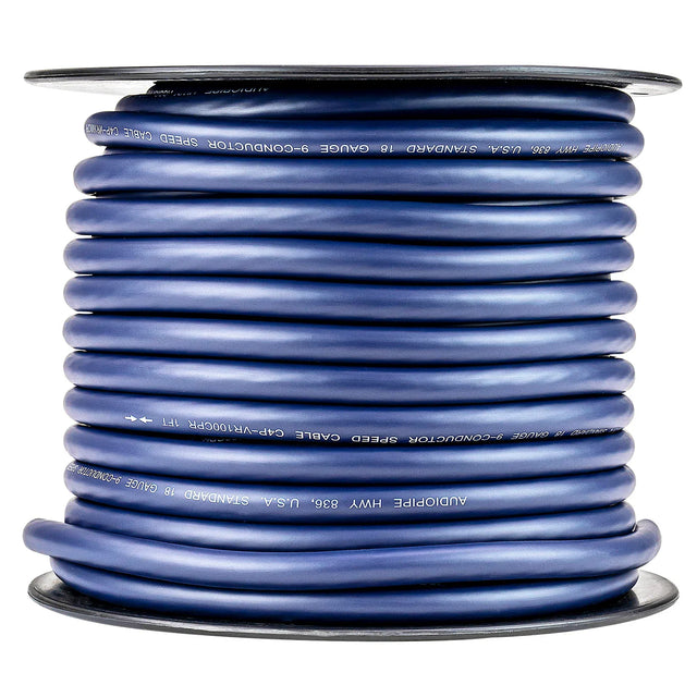 Coiled 9-conductor speed cable with blue jacket on spool