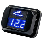 Audiopipe digital voltage meter angled view with blue LCD showing 12.xV, black case