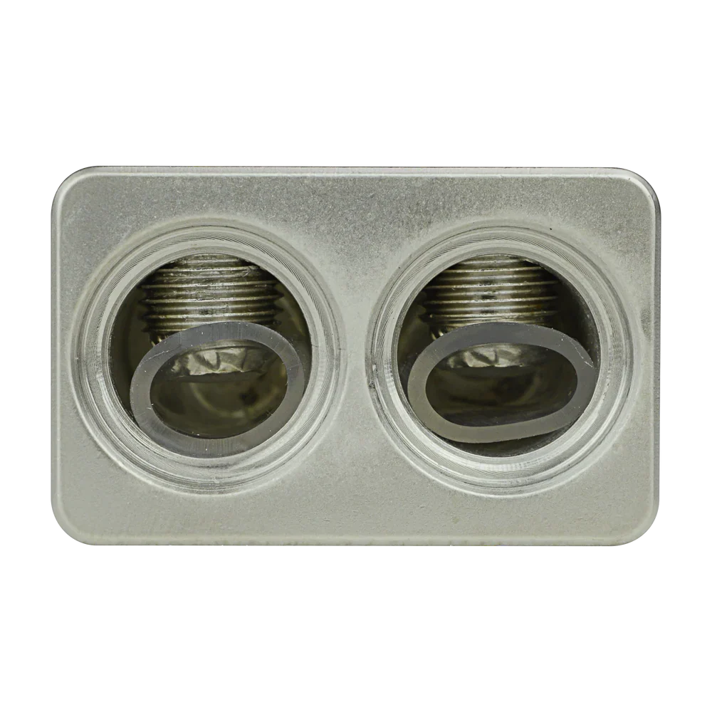 Audiopipe amp input reducer close-up of two threaded ports on silver plate