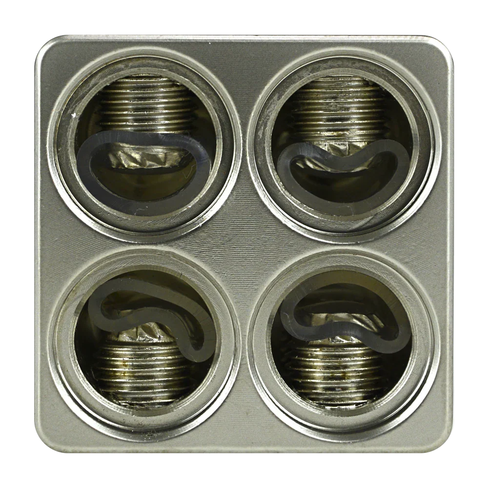 Close-up of threaded bolt ports on metal amp input reducer, four openings in plate