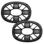 Two black speaker grilles with radial supports and oval tweeter windows