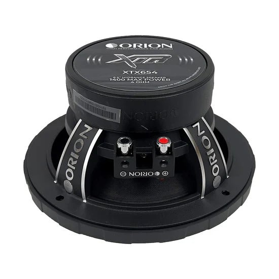 Black midrange speaker showing XTX654 branding and dual binding posts on front