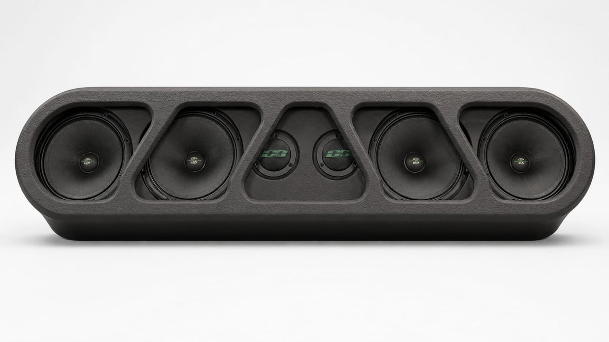 Black speaker rack with five round drivers and sculpted grille panel