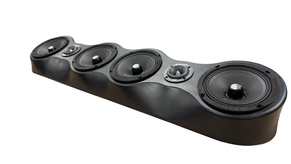 Black speaker bar angled view with multiple round speaker grilles