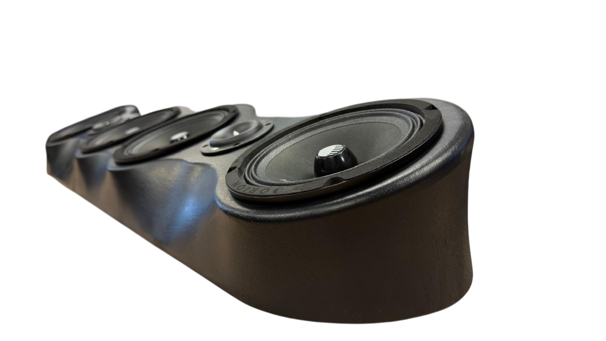 Black speaker bar side view with large center driver and smaller tweeter openings